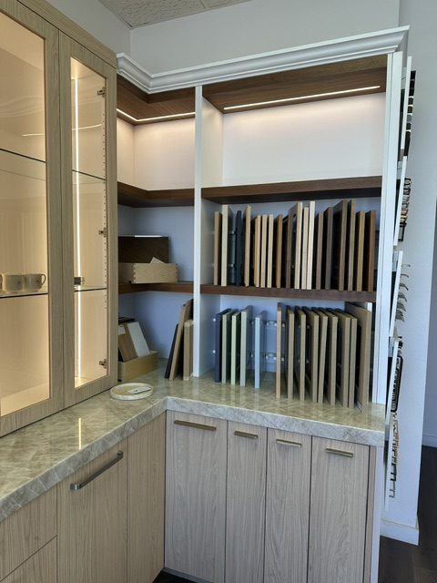 Open shelving and cabinetry at the corner of a built-in installation