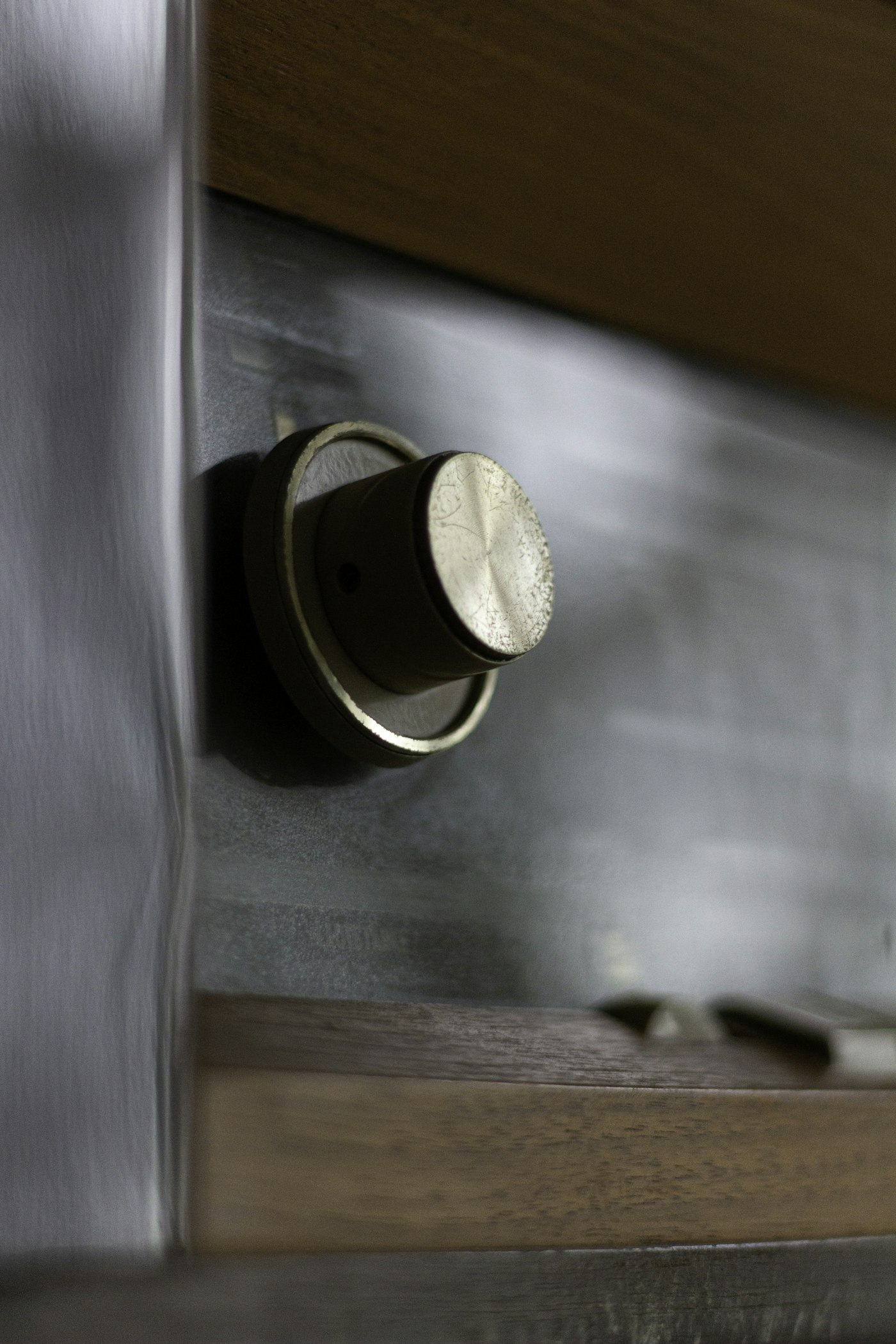 Solid brass cabinet knob on a drawer front
