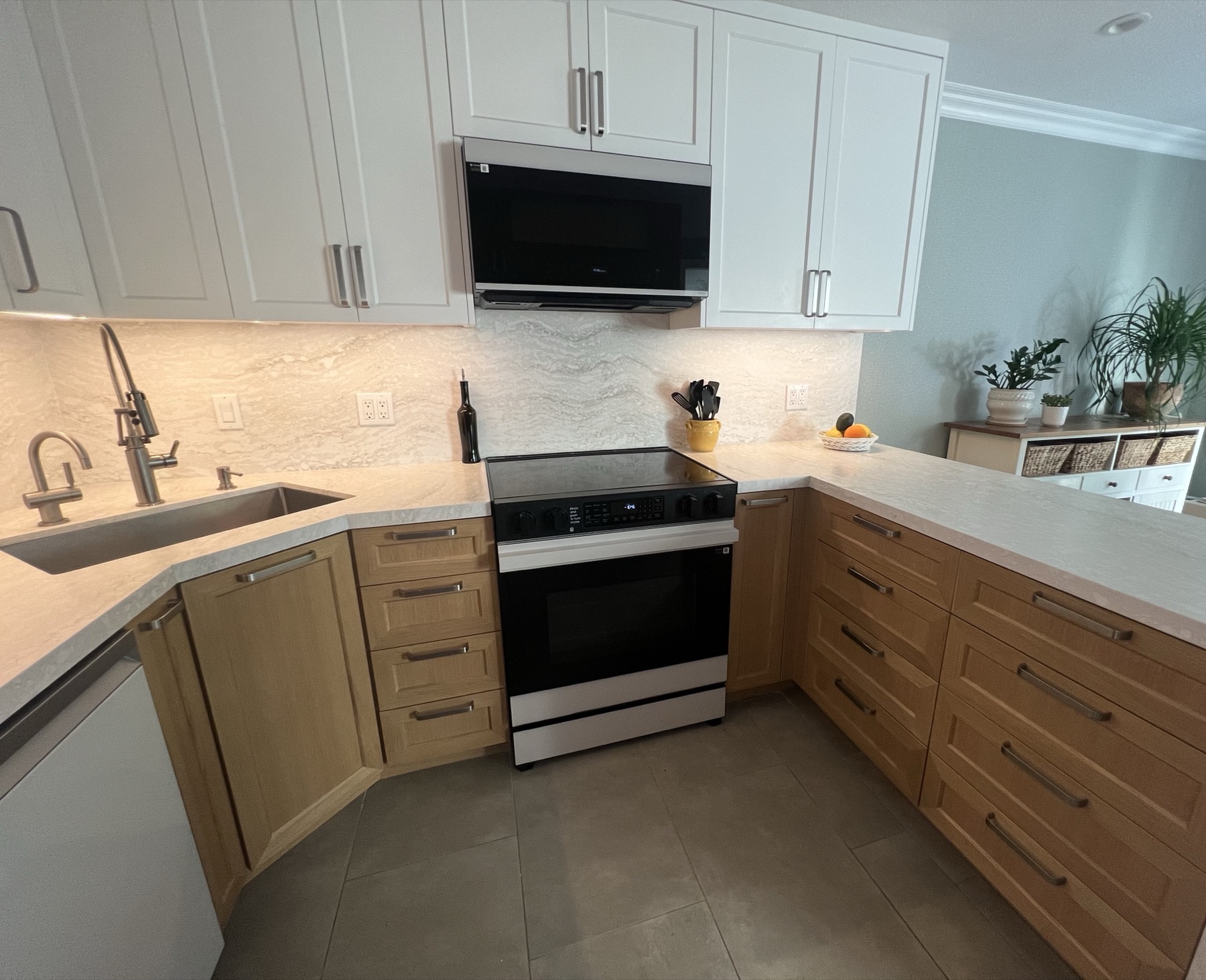 Corner sink, range and base cabinets seen from above the dishwasher