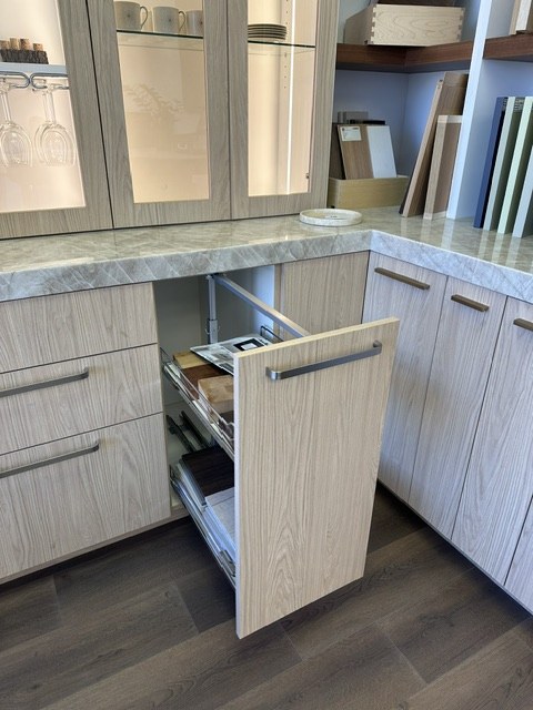 Open pull-out storage in a wood-grain kitchen display