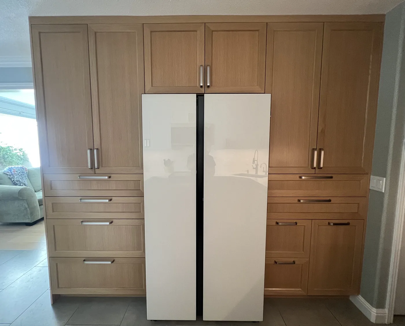 Tall warm-wood refrigerator surround