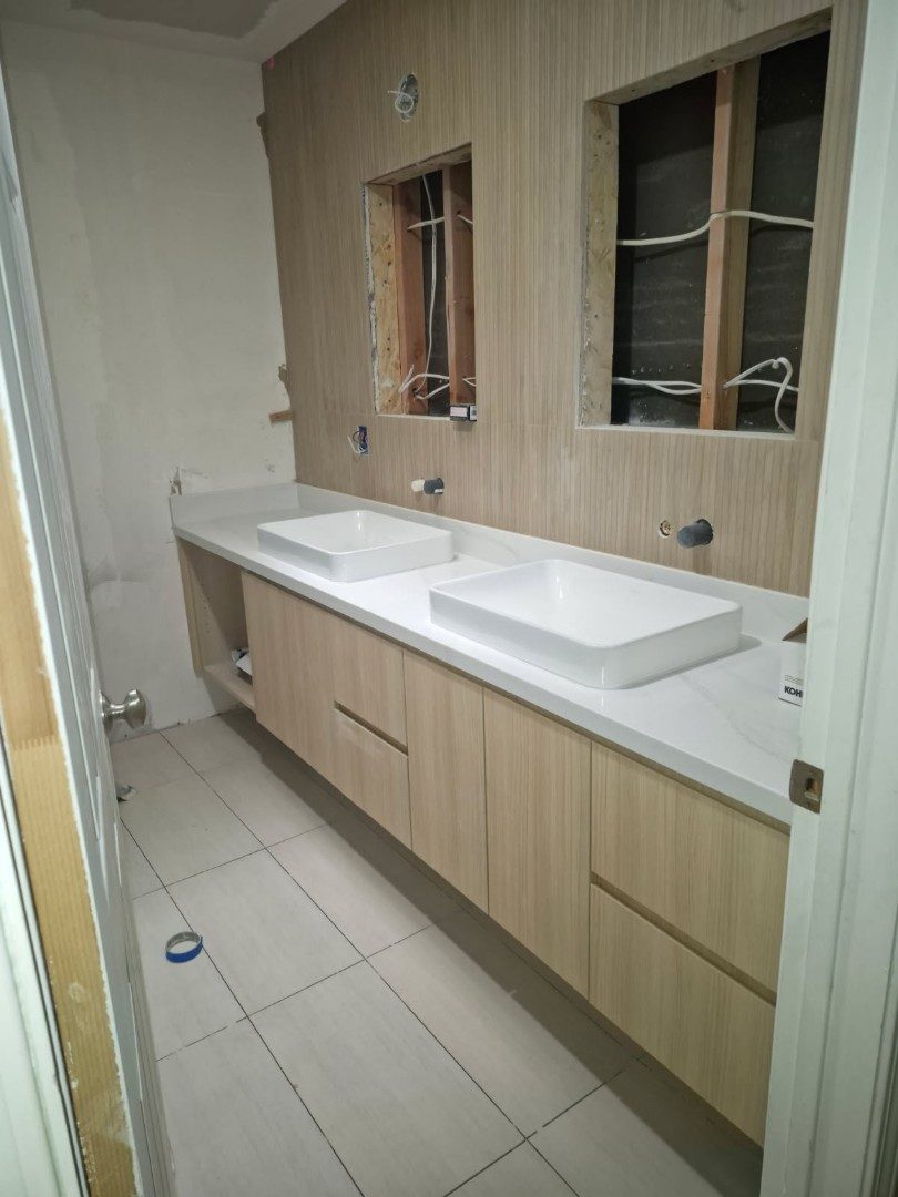 Light wood double vanity with vessel sinks